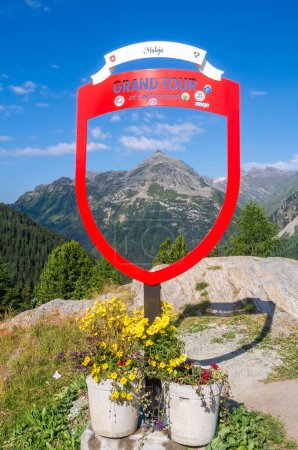 Photo for Maloja, Switzerland - July 10, 2023: Tourist photo point and a stunning mountain landscape of the Maloja mountain pass in Switzerland - Royalty Free Image