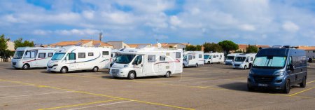 Photo for Saintes Maries de la Mer, France - October 2, 2023: Panoramic image of motorhomes in the parking lot of a tourist resort in the Camargue - Royalty Free Image