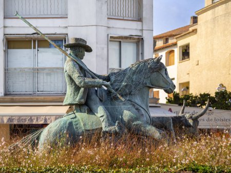 Photo for Saintes Maries de la Mer, France - October 3, 2023: Bronze sculpture of a rider on a horse in the Camargue - Royalty Free Image