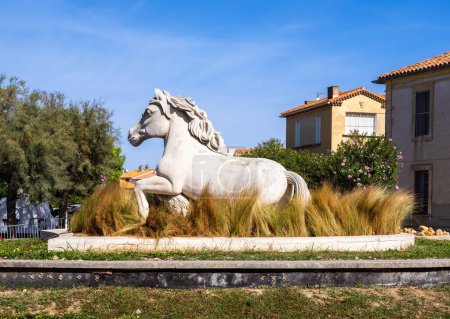 Photo for Saintes Maries de la Mer, France - October 3, 2023: A sculpture of a white horse, typical of the Camargue region - Royalty Free Image