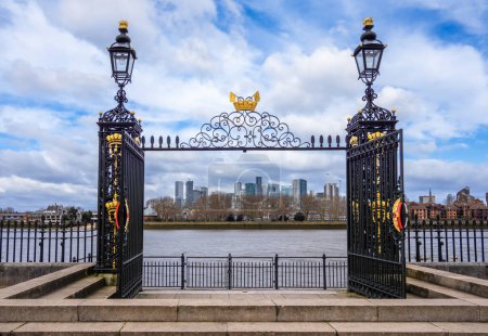 London, United Kingdom - February 26, 2024: Scenic view through the Greenwich palace steps over the river Thames in the direction of the Canary Wharf financial buildings.