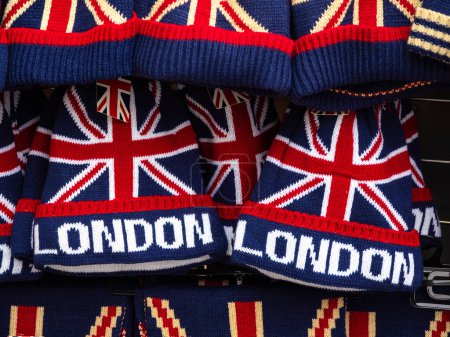 Photo for London, United Kingdom - February 26, 2024: Commemorative London and English flag woolen beanies - Royalty Free Image
