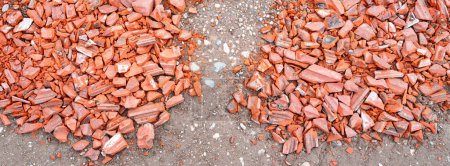 Photo for Shards of roof tiles for patching holes in the carriageway - Royalty Free Image
