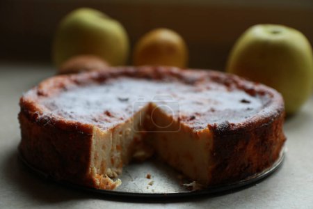 Photo for Homemade cheesecake, background with apples - Royalty Free Image