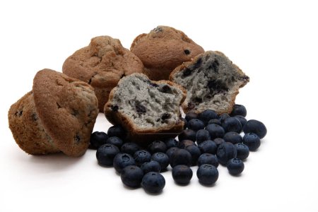 Blueberry Muffins and blueberries isolated in a white background.