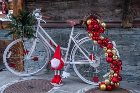 Photo for Bicycle with Christmas decoration. One white bicycle with golden and red Christmas balls. Holidays backgroudns. - Royalty Free Image