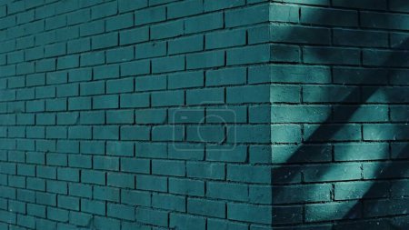 Photo for Corner of brick wall painted green - Royalty Free Image