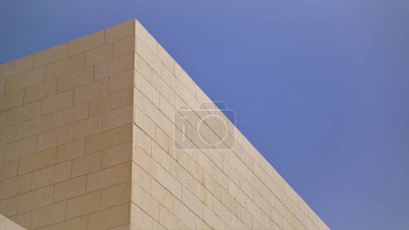 angled corner of stone walls against the sky