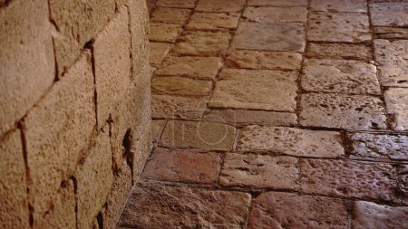 Photo for Stone floor with stone wall - Royalty Free Image