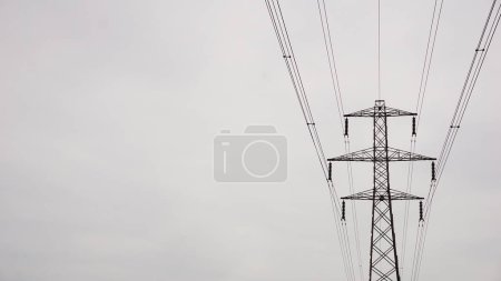 Photo for High voltage electric tower against white sky - Royalty Free Image
