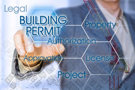 Buildin Permit Unternehmenskonzept mit Geschäftsführer zeigt auf Symbole gegen ein digitales Display