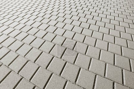 Photo for Gray concrete flooring block assembled on a substrate of sand - type of flooring permeable to rain water as required by the building laws - Royalty Free Image