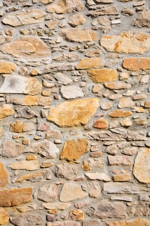 Photo for Old wall built with irregularly shaped stone blocks recently restored - Royalty Free Image