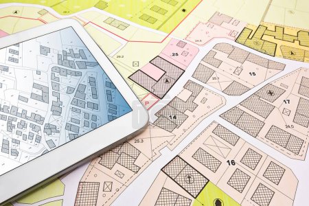 Buildings Permit concept with imaginary cadastral on digital tablet - building activity and construction industry with General Urban Plan
