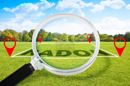 Photo for Radon gas alertness - concept with text over a green mowed lawn of a land and magnifying glass - Royalty Free Image