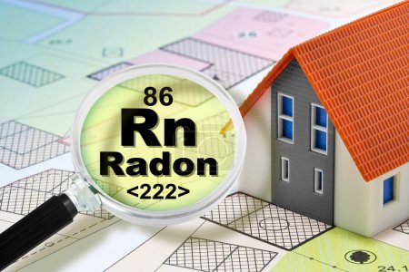 The danger of radon gas in our homes - concept with presence of radon gas under the soil of our cities and buildings with magnifying glass