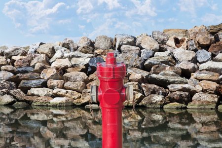 Photo for Hydrant concept against a wall of rocks - Plenty of water concept - Royalty Free Image