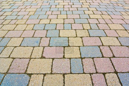 Photo for Colored concrete self locking flooring blocks assembled on a substrate of sand - type of flooring permeable to rain water as required by the building laws - Royalty Free Image