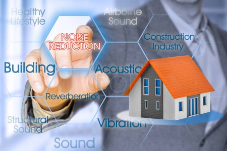 Photo for Noise reduction in buildings concept with business manager pointing to icons against a digital display and home mode - Royalty Free Image