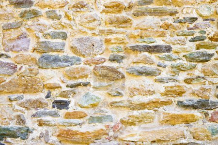 Photo for Old medieval italian stone wall, built with splitted blocks, recently restored - Royalty Free Image
