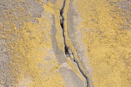 Photo for Dangerous cracked old wall with damaged plaster caused by structural problems, earthquake or subsidence of the foundation soil - Royalty Free Image