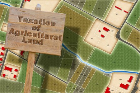 Photo for Property tax and costs on land for agricultural use - concept with an imaginary cadastral map and information placard - Royalty Free Image