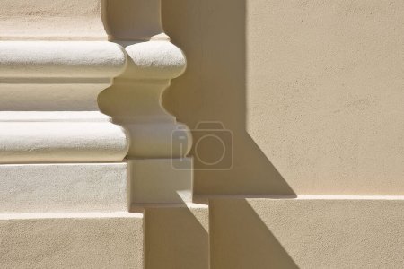 Photo for Base of column with colored plaster wall and frame of a classic Italian church - Royalty Free Image