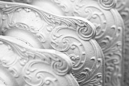 Photo for Old white vintage cast iron italian radiator detail with floral decoration. - Royalty Free Image