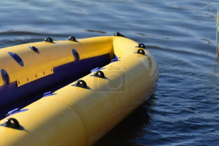 Photo for Yellow inflatable kayak on the river closeup - Royalty Free Image