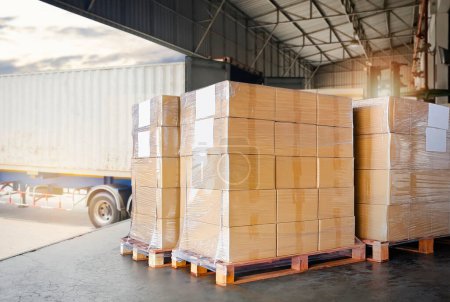 Photo for Packaging Boxes Wrapped Plastic Stacked on Pallets Loading into Cargo Container. Distribution Supplies Warehouse. Shipping Trucks. Supply Chain Shipment Boxes. Freight Truck Logistics Cargo Transport - Royalty Free Image