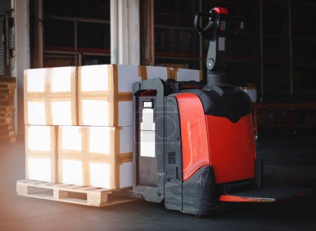 Photo for Packaging Boxes Stacked on Pallet with Electric Forklift Pallet Jack. Cartons Cardboard Boxes. Supply Chain. Shipping Warehouse. Supplies Warehouse Logistics. - Royalty Free Image