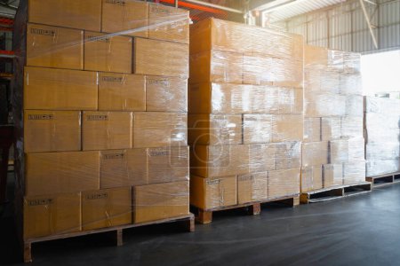 Photo for Package Boxes Wrapped Plastic Stacked on Pallets. Storage Warehouse, Storehouse Distribution. Supply Chain. Shipping Cargo Supplies Warehouse Logistics. - Royalty Free Image