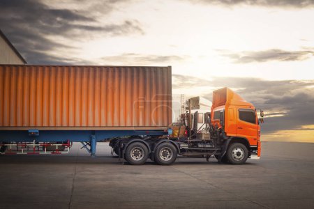 Photo for Semi Trailer Trucks on The Parking Lot with The Sunset. Trucks Loading at Dock Warehouse. Shipping Cargo Container. Delivery Trucks, Distribution, Freight Trucks Cargo Transport, Warehouse Logistics. - Royalty Free Image