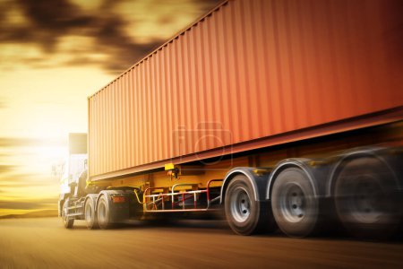 Speed Motion of Semi Trailer Truck Driving on The Road with The Sunset. Commercial Truck, Express Delivery Transit. Shipping Container Truck Transport. Freight Trucks Logistics Cargo Transport.