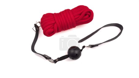 Photo for Mouth gag and red rope to tie for bdsm. High quality photo - Royalty Free Image
