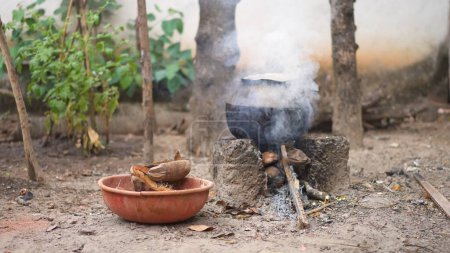 Photo for Cooking pot on the fire preparing food with smoke outdoors. High quality photo - Royalty Free Image