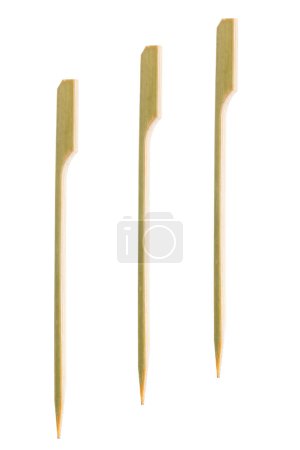 It is Three bamboo skewers isolated on white.