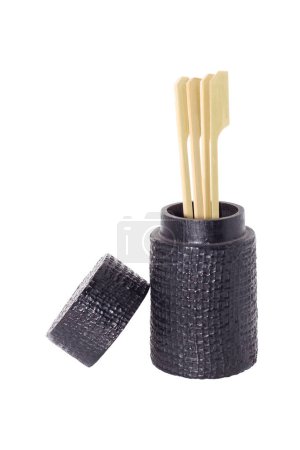 It is Skewer and toothpick in black holder isolated on white.