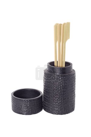 It is Skewer and toothpick in black holder isolated on white.