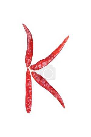 it is capital letter K by dry chili isolated on white.