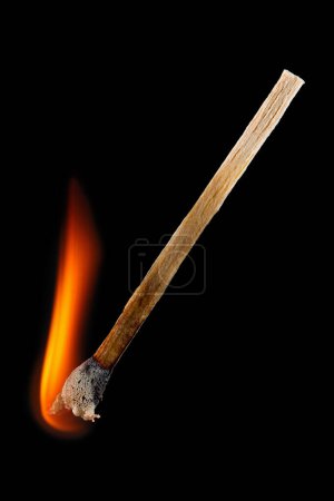 It is Burning match stick isolated on black.