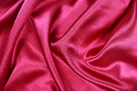 It is Curved design on red silk for pattern and background.