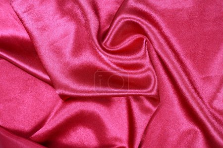 It is Curved design on red silk for pattern and background.