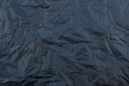 Téléchargez les photos : Il est ridé texture de tissu de soie noire pour le fond et le design. - en image libre de droit