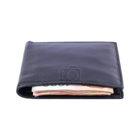 it is money in black leather wallet isolated on white.