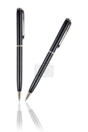 it is two luxurious black business pens with reflection isolated on white.