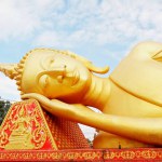 Big golden buddha statue sleeping for laos people worship, hollow or adore near Pha That Luang temple, Vientiane, Laos. Famous temple for tourism visit and travel to Vientiane.