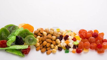 Mix of dried fruits and nuts on white background. Healthy food concept.