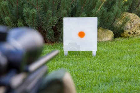 Photo for Paintball target on a green grass in a game shooting range - Royalty Free Image