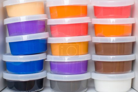 Photo for Transparent plastic containers with colorful air dry clay. - Royalty Free Image